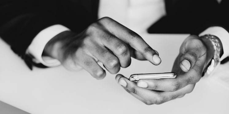 businessperson's hands holding phone