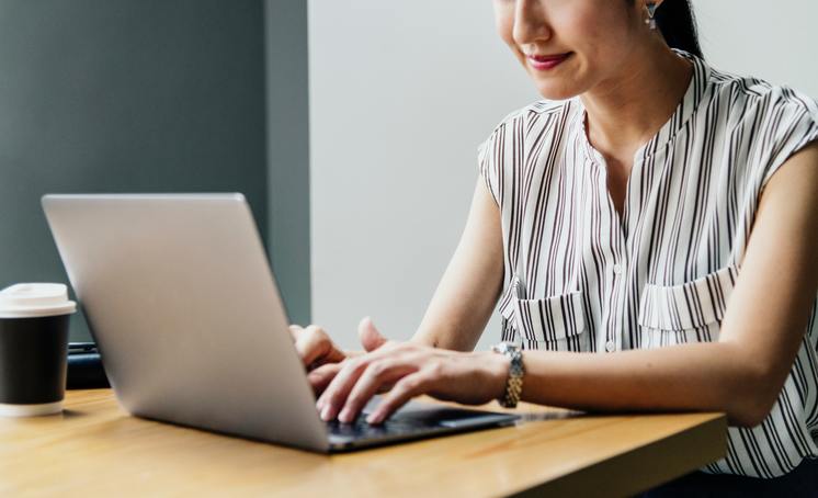 hired copywriter creating quality content on laptop