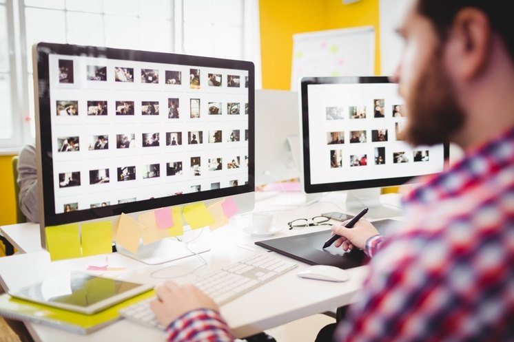 man resizing and compressing images for small business website