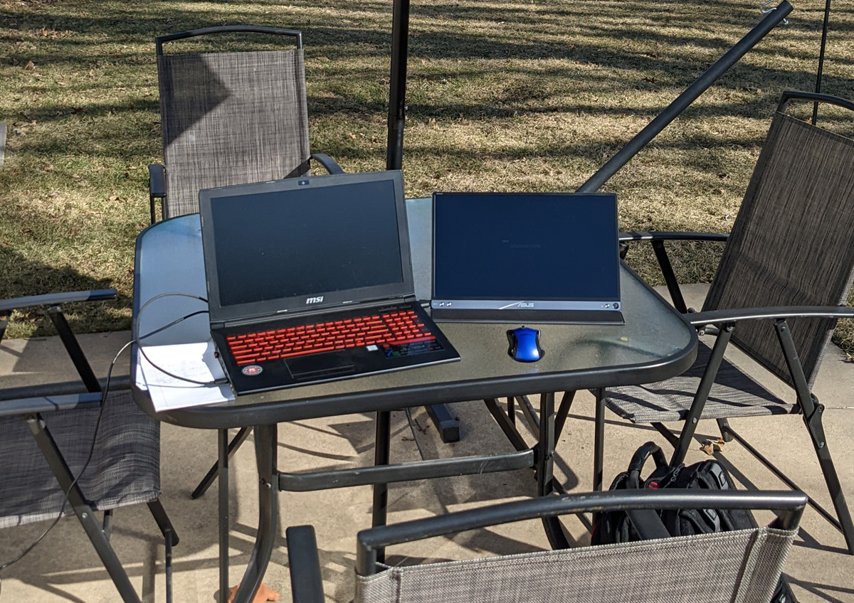 dual laptop monitor setup outside